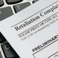 Closeup of a workplace retaliation complaint form.