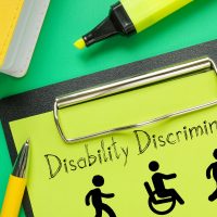 Disability Discrimination is shown on the business photo using the text