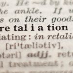 Dictionary definition of word retaliation, selective focus.