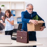 Two male and one female employees working in the office Two male and one female employees working in the office