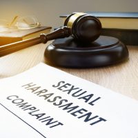 Sexual harassment complaint and gavel on a desk. Sexual harassment complaint and gavel on a desk.