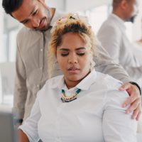 Sexual harassment, touch and uncomfortable with a business man putting a hand on the shoulder of a woman colleague. Exploitation, unprofessional and victimization with an employee touching a coworker Sexual harassment, touch and uncomfortable with a business man putting a hand on the shoulder of a woman colleague. Exploitation, unprofessional and victimization with an employee touching a coworker