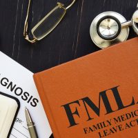 FMLA Family medical leave act is shown using a text FMLA Family medical leave act is shown using a text